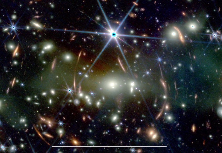 Zoom into space: This JWST image shows the galaxy cluster SMACS J0723.3−7327 with a large number of lensed background galaxies. The white bar at the bottom corresponds to 50 arcsec, which is approximately the maximum size of Jupiter observed from Earth.
